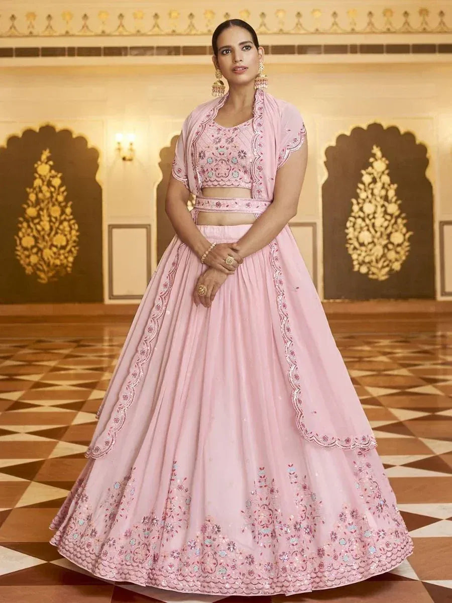 Pink embroidered lehenga choli with floral motifs, perfect for Indian ethnic wear occasions