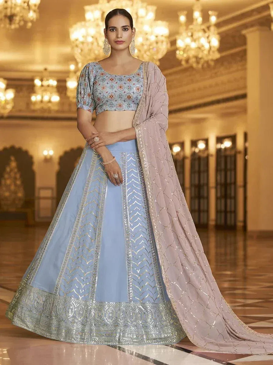 Light blue embroidered lehenga choli with floral blouse and pink dupatta, perfect for Indian weddings and festivals