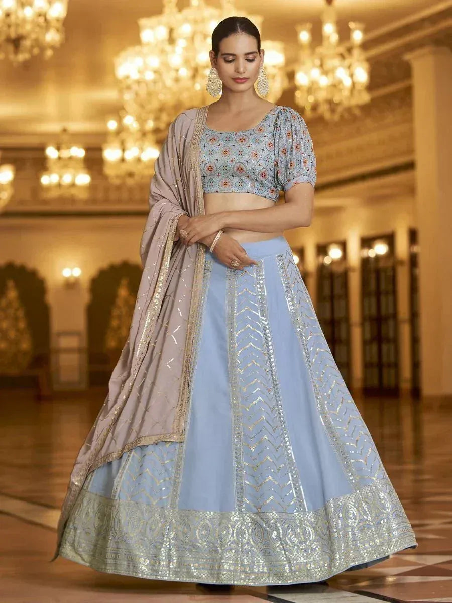 Light blue embroidered lehenga choli with floral blouse and dupatta, perfect for Indian weddings and festive occasions.