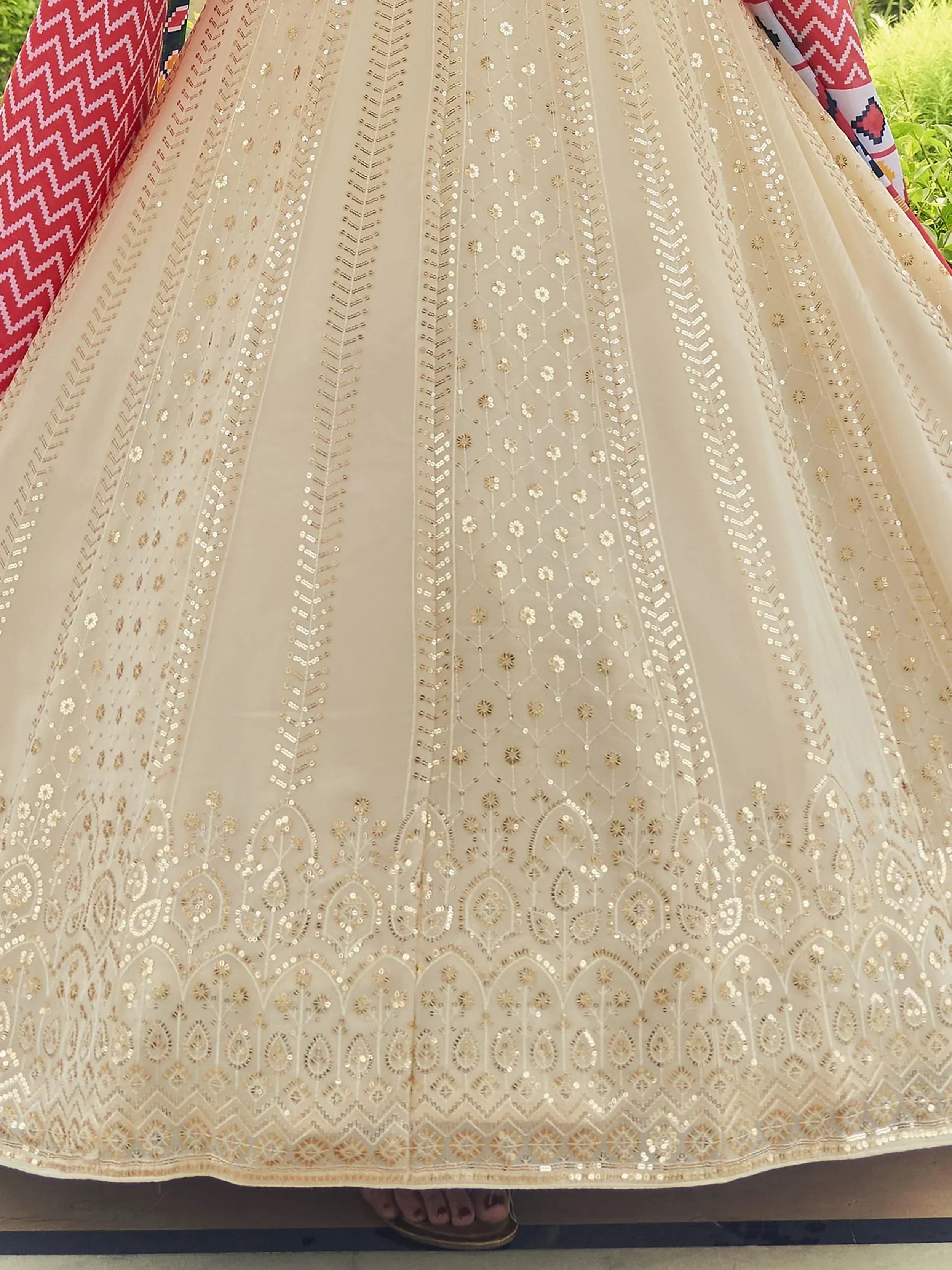 Elegant beige lehenga with gold embroidery and sequins, perfect for Indian ethnic wear