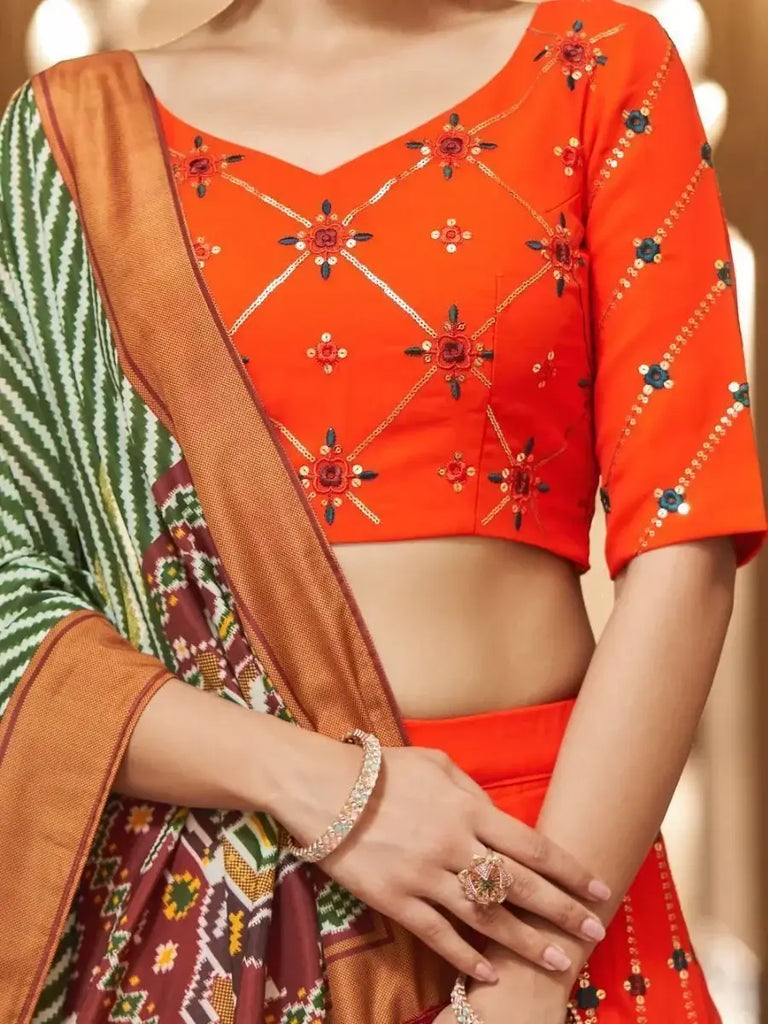 Appealing Orange Sequins Embroidery Georgette Lehenga Choli
