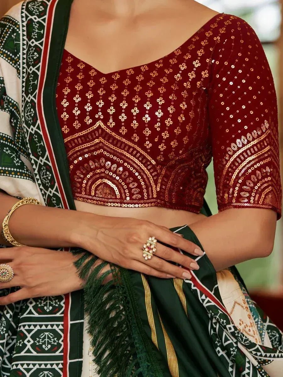 Maroon sequin embroidered blouse with green patterned saree, ethnic Indian wear