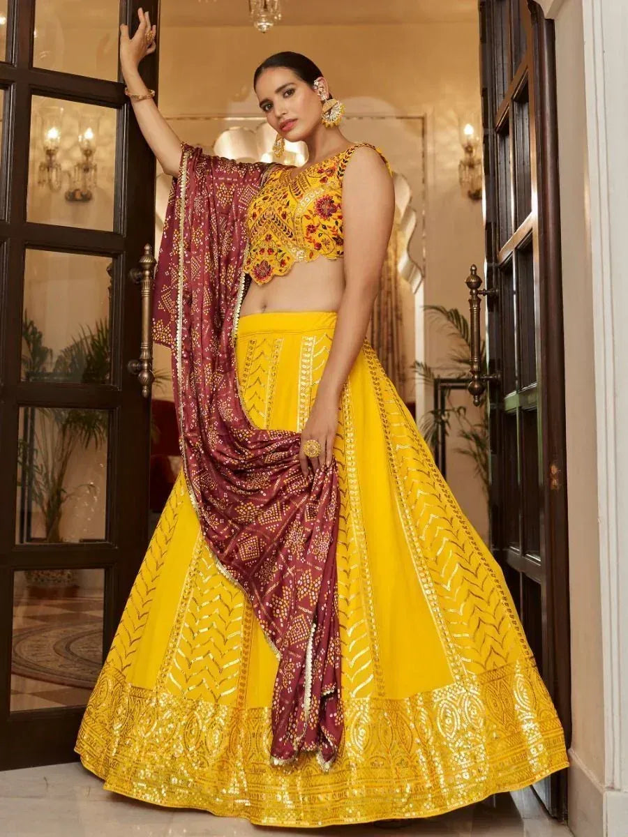 Yellow embroidered lehenga choli with maroon dupatta, Indian ethnic wear for weddings and festivals