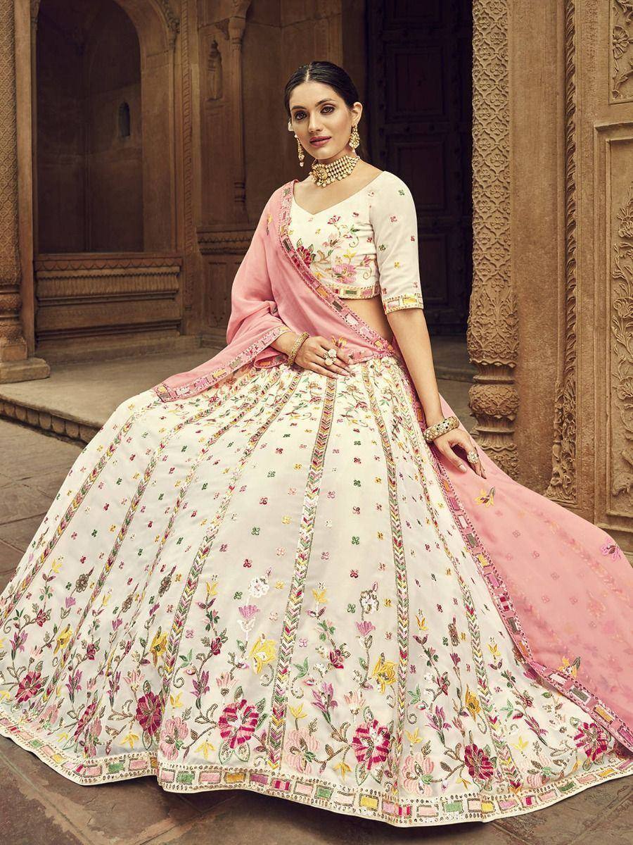 Elegant floral embroidered lehenga choli with pink dupatta, perfect for Indian weddings and festive occasions.