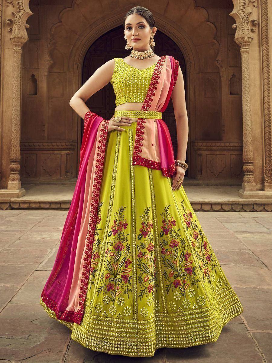Vibrant yellow lehenga choli with floral embroidery, pink dupatta, perfect for Indian weddings and festive occasions