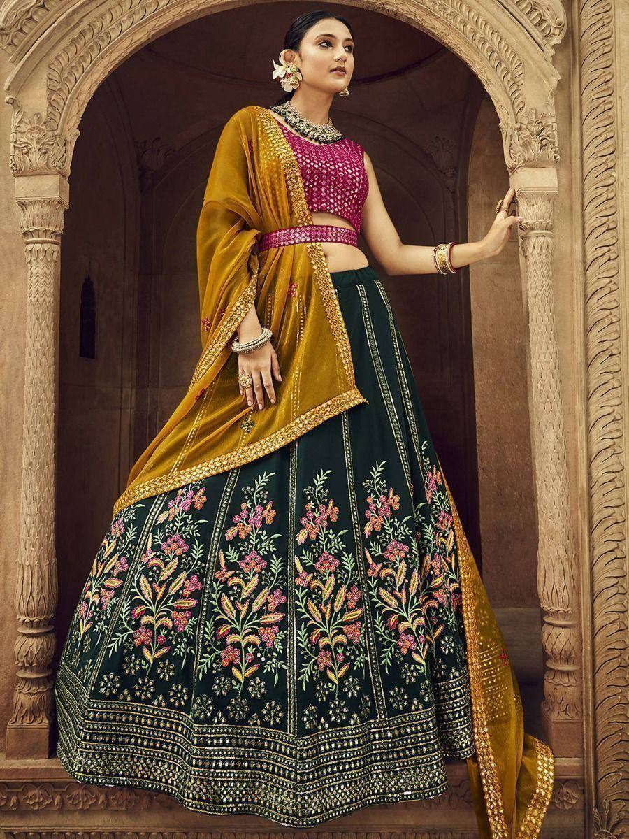 Elegant Indian lehenga choli with floral embroidery, pink blouse, and mustard dupatta, perfect for weddings and festivals.
