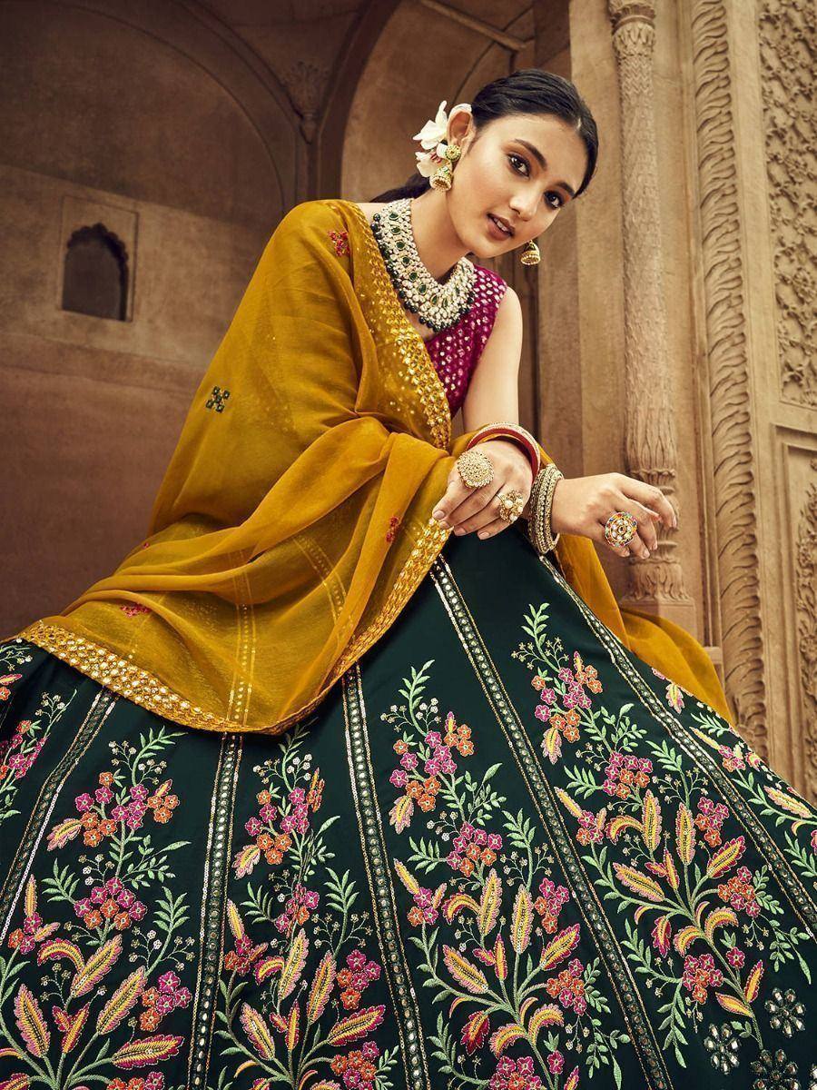 Elegant Indian lehenga choli with floral embroidery, mustard dupatta, and traditional jewelry for ethnic wear