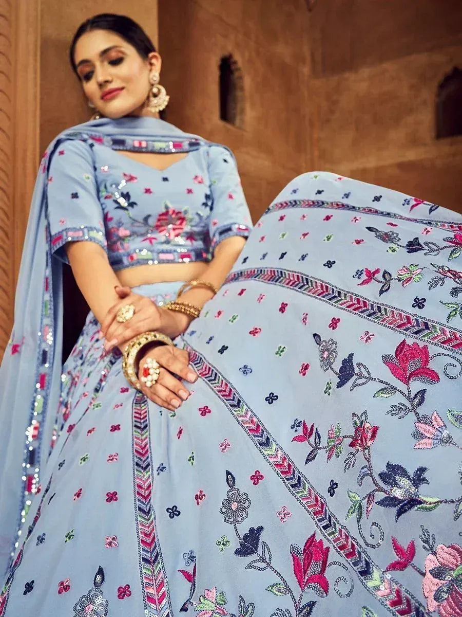 Light blue embroidered lehenga choli with floral motifs and sequin detailing, perfect for Indian ethnic occasions