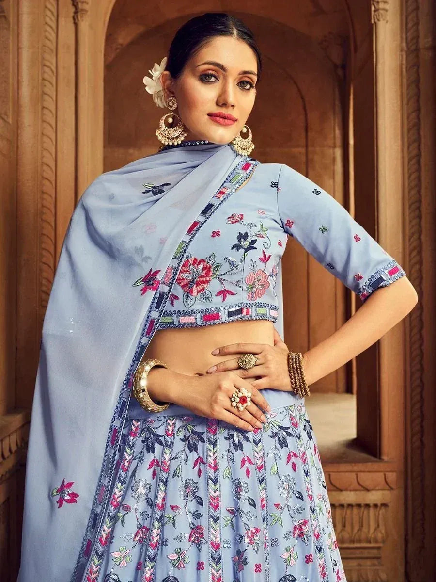 Light blue embroidered lehenga choli with floral motifs, perfect for Indian ethnic wear occasions