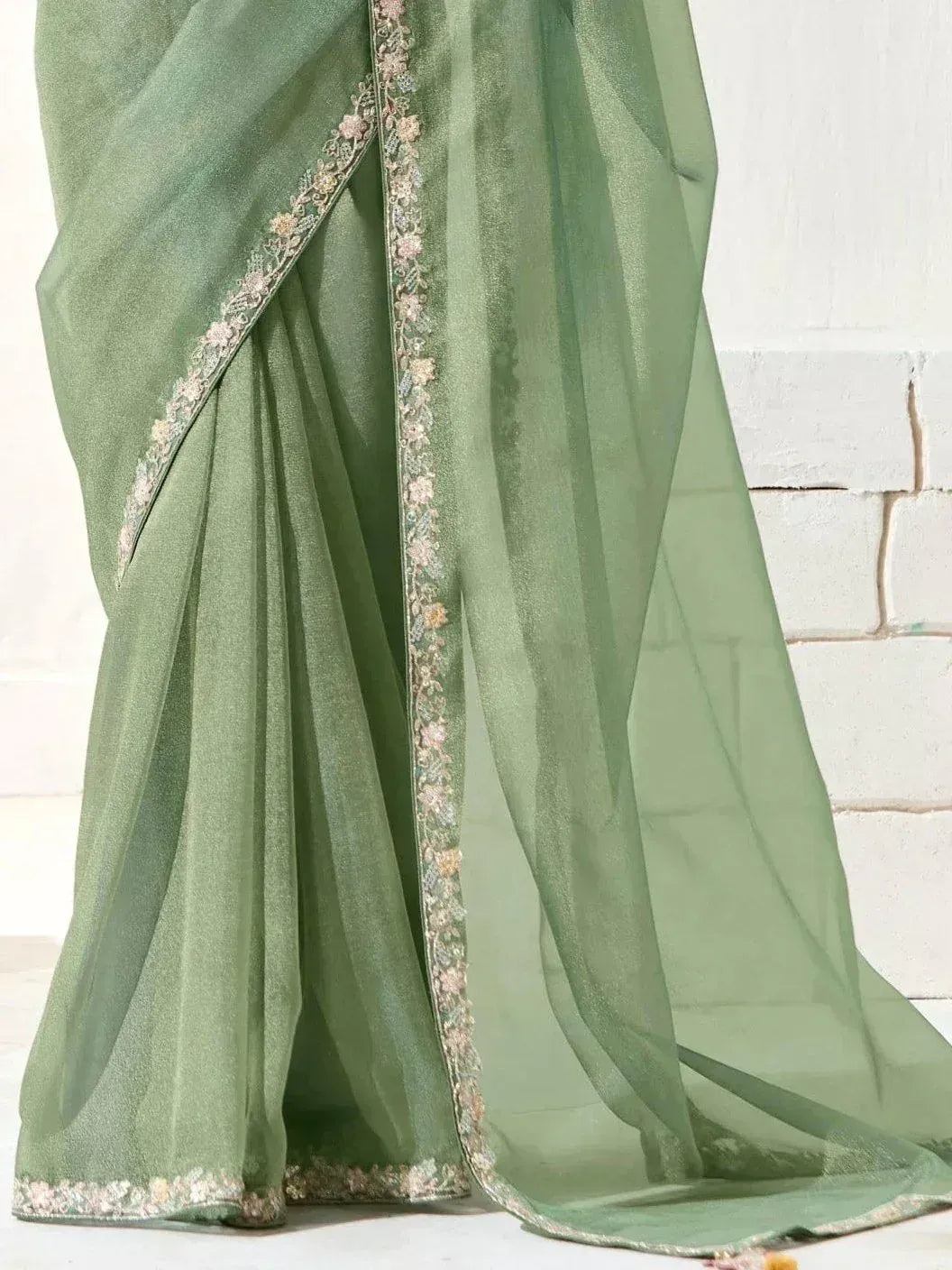 Elegant green saree with floral embroidery, perfect for Indian ethnic wear occasions