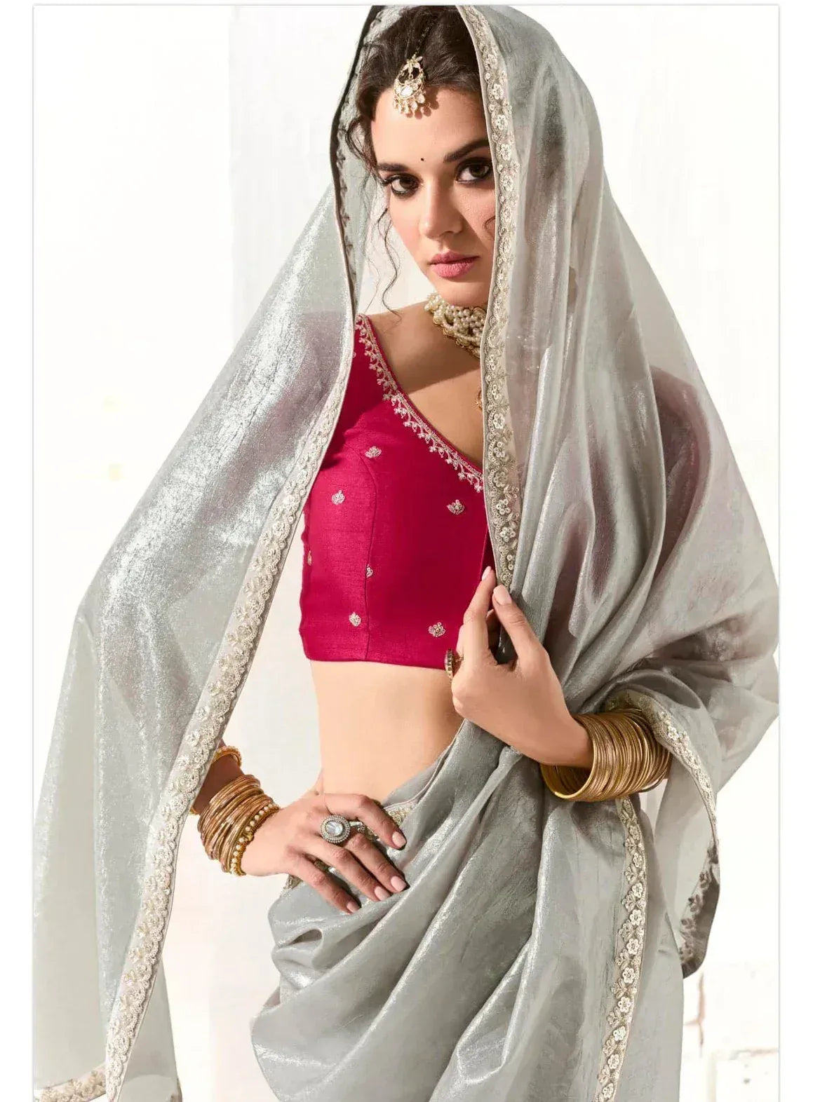 Elegant silver saree with red blouse, perfect for Indian ethnic wear and festive occasions