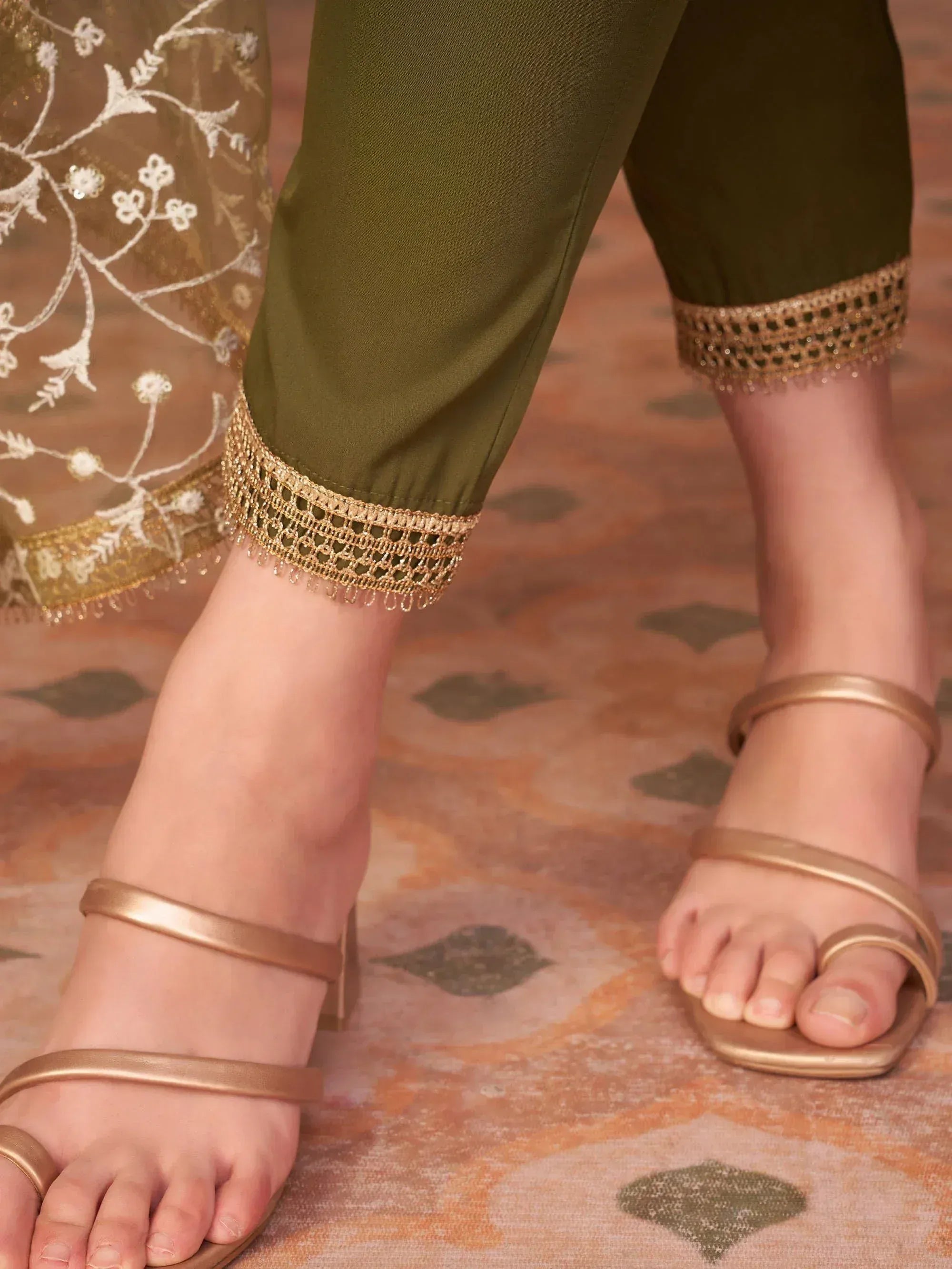 Olive green palazzo pants with gold lace trim, paired with gold strappy heels and embroidered dupatta