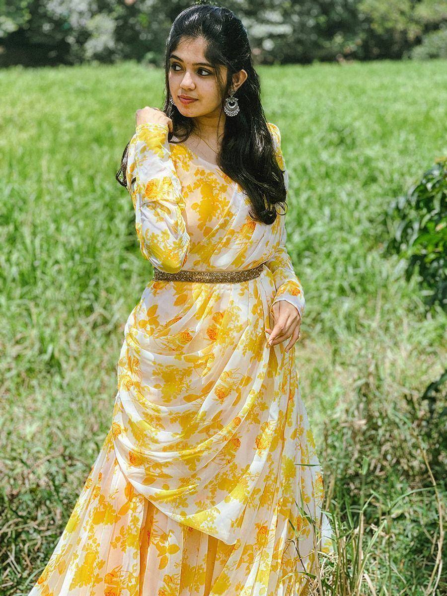 Yellow floral ethnic gown with draped design, perfect for festive occasions and Indian wear