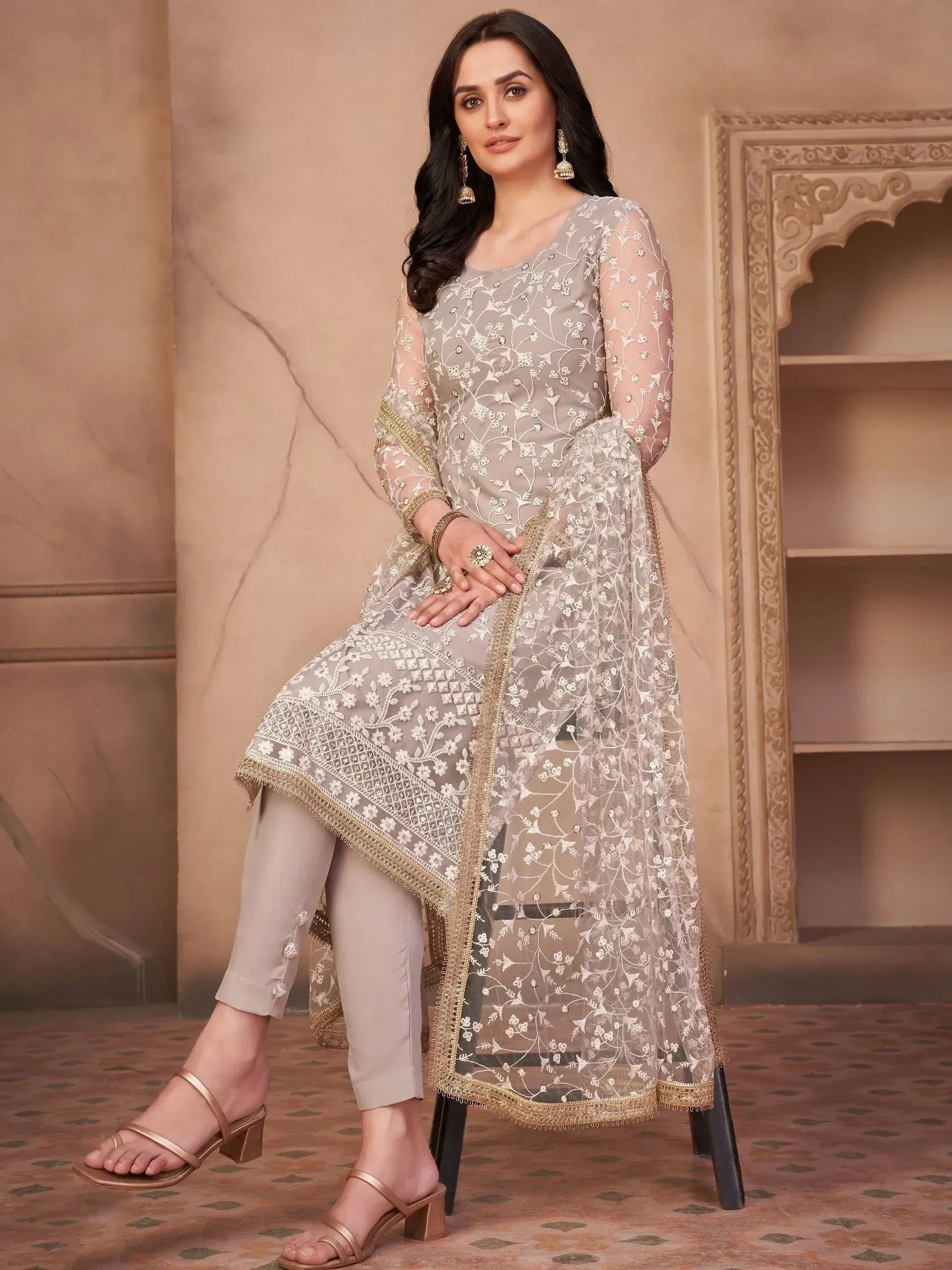 Elegant grey embroidered salwar kameez with sheer dupatta, perfect for Indian ethnic wear occasions.