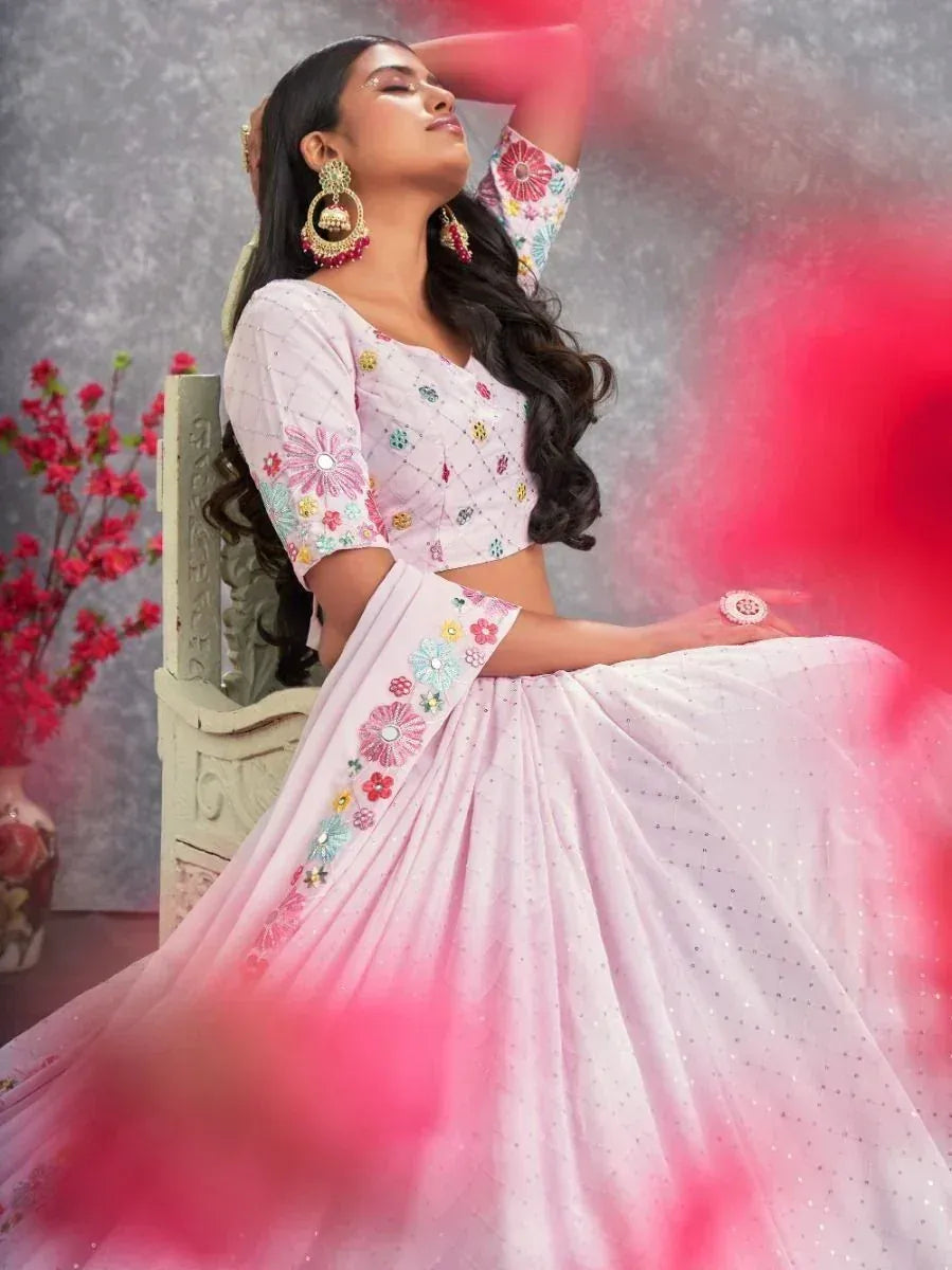 Pink floral embroidered lehenga choli with mirror work, perfect for Indian ethnic occasions