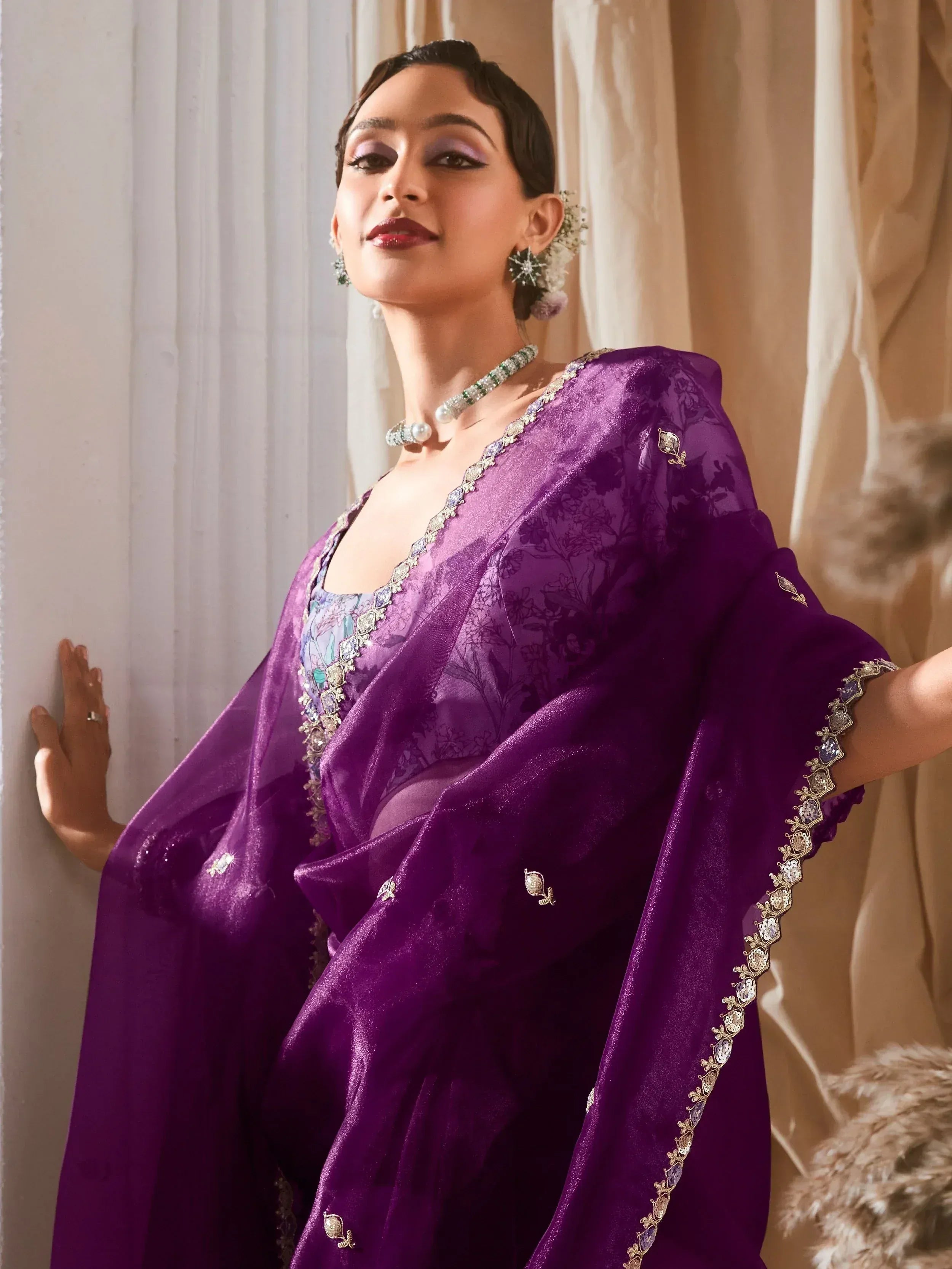 Elegant purple ethnic gown with floral embroidery and stone detailing, perfect for Indian occasions
