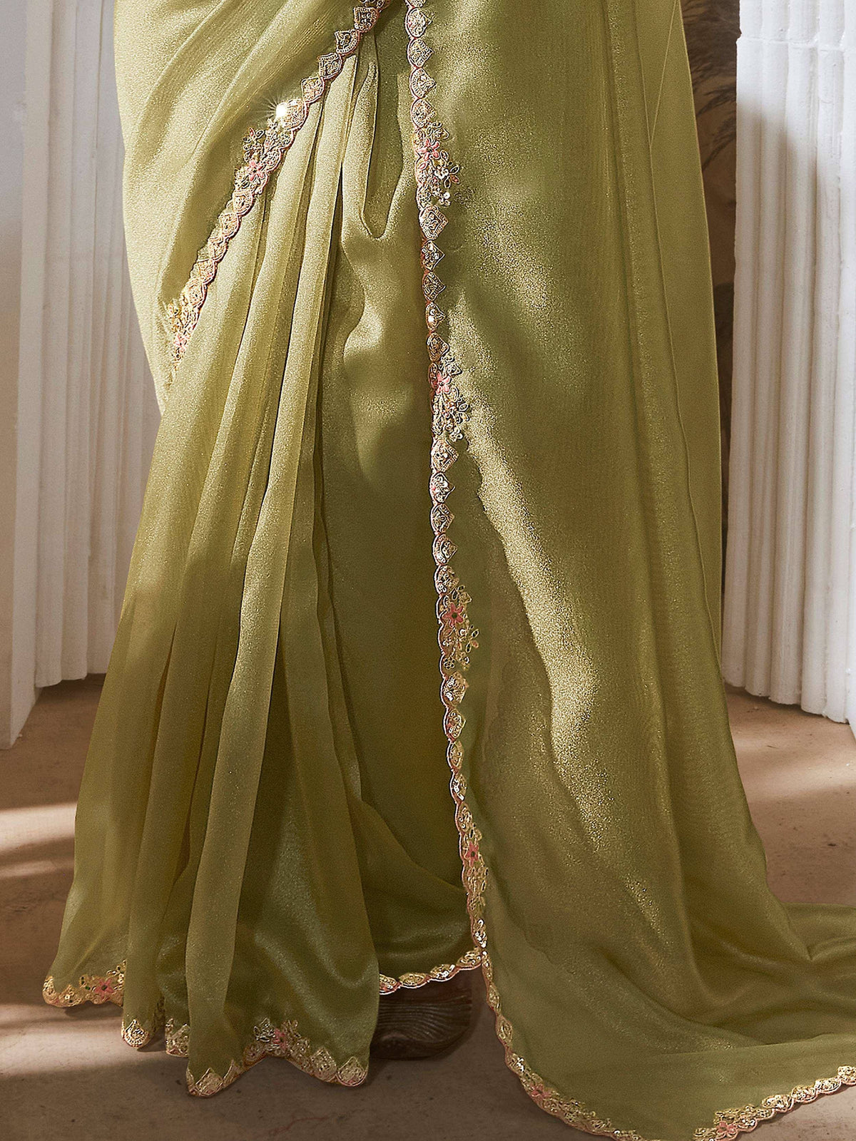 Olive green ethnic gown with gold and pink embroidery, perfect for Indian occasions