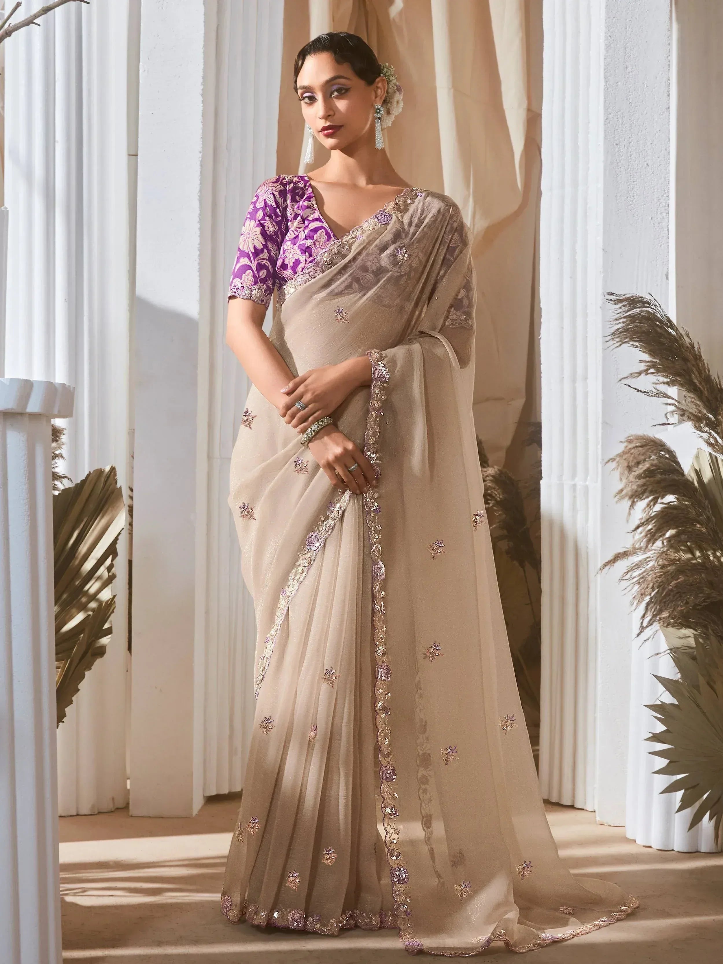 Elegant beige saree with purple floral blouse, perfect for Indian ethnic wear occasions
