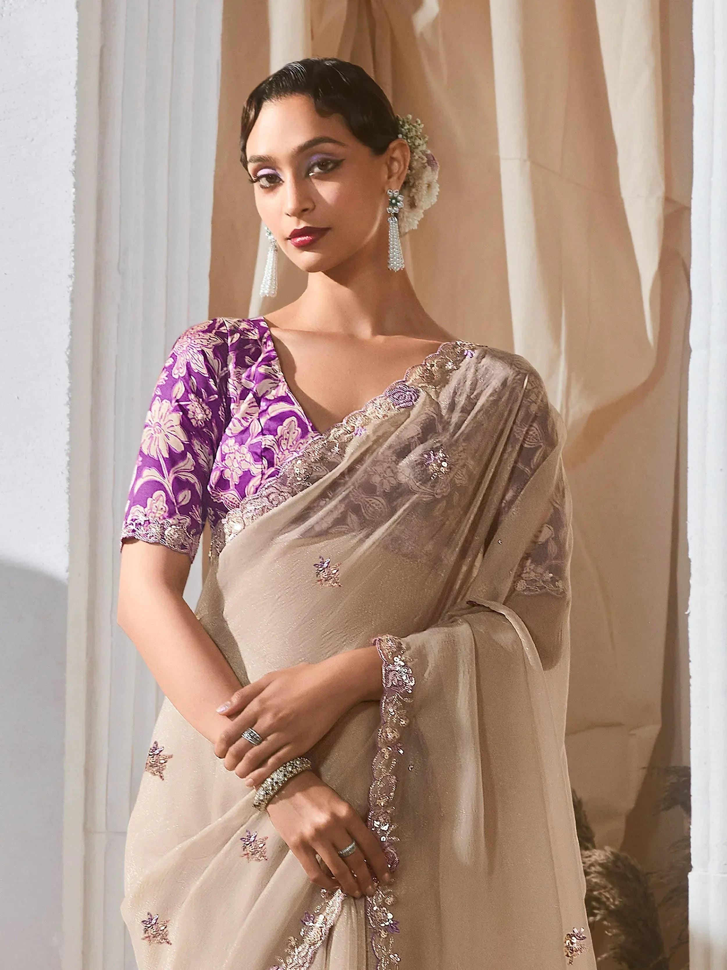Elegant beige saree with purple floral blouse, perfect for Indian ethnic wear occasions