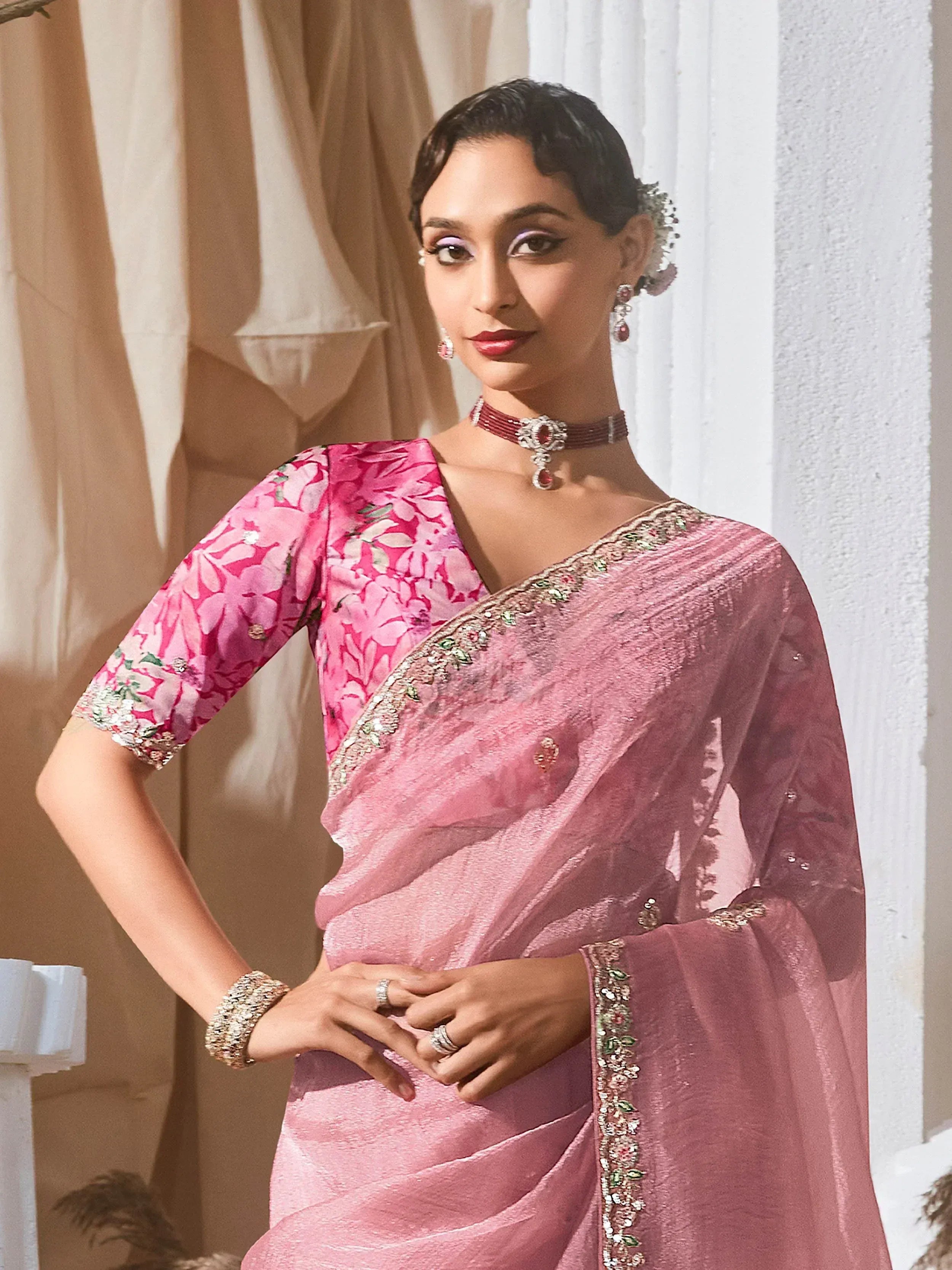 Pink floral saree with embroidered border, perfect for Indian ethnic wear occasions