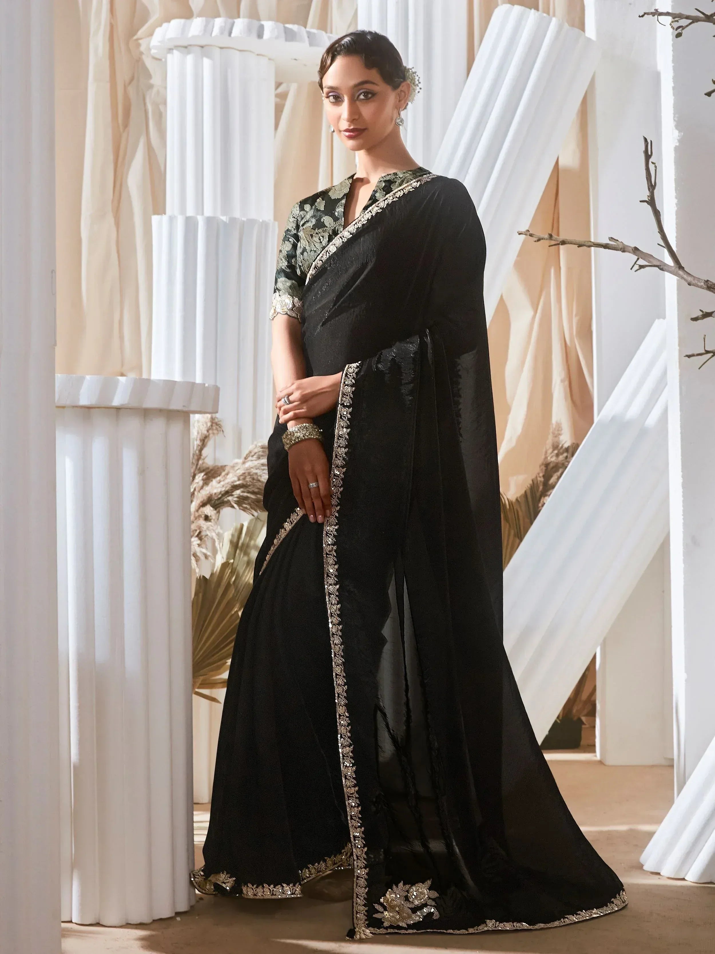 Elegant black saree with gold embroidery, perfect for Indian ethnic wear and festive occasions.