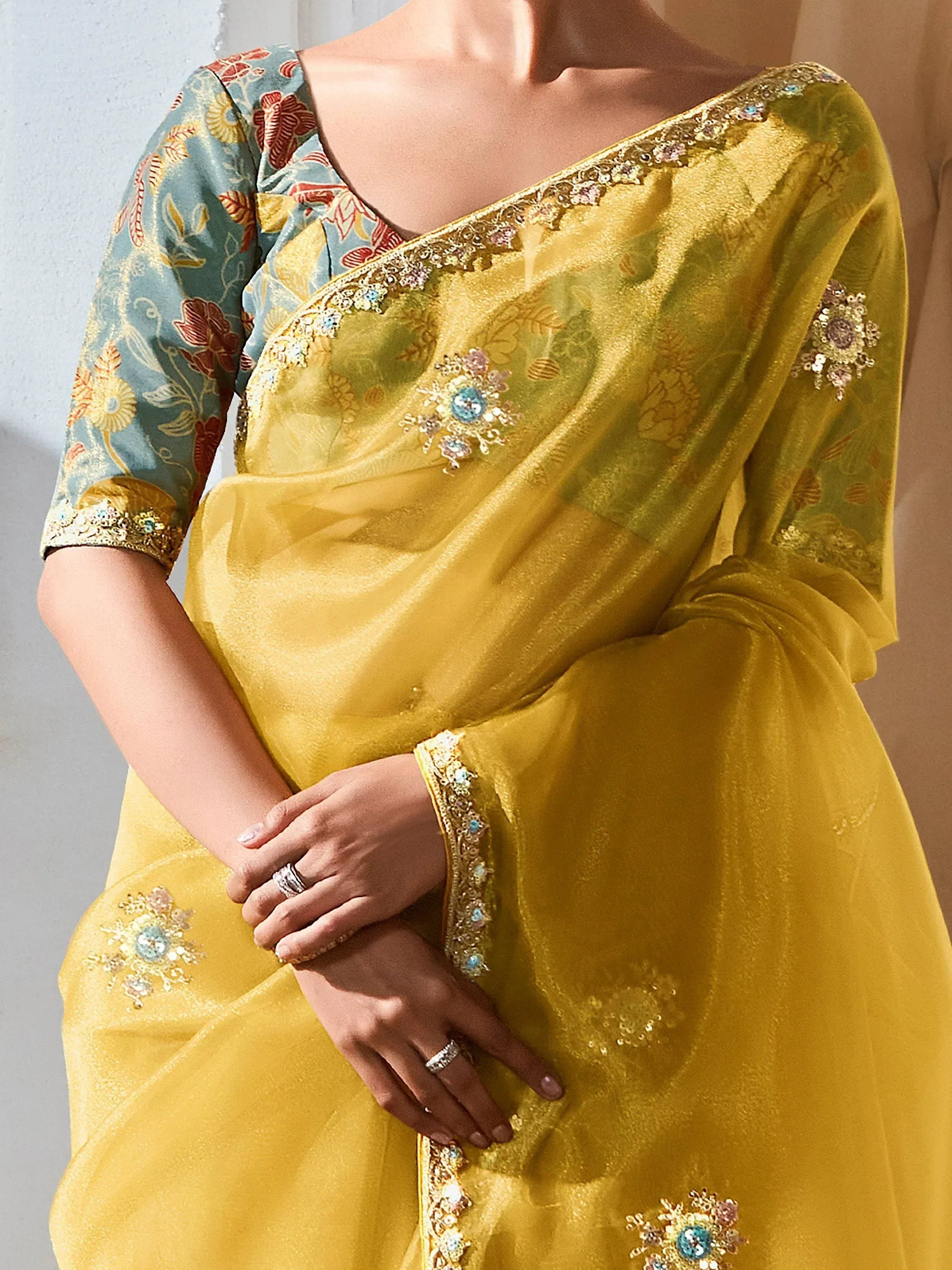 Yellow designer saree with floral blouse, sequin embroidery, and stone work for Indian ethnic wear