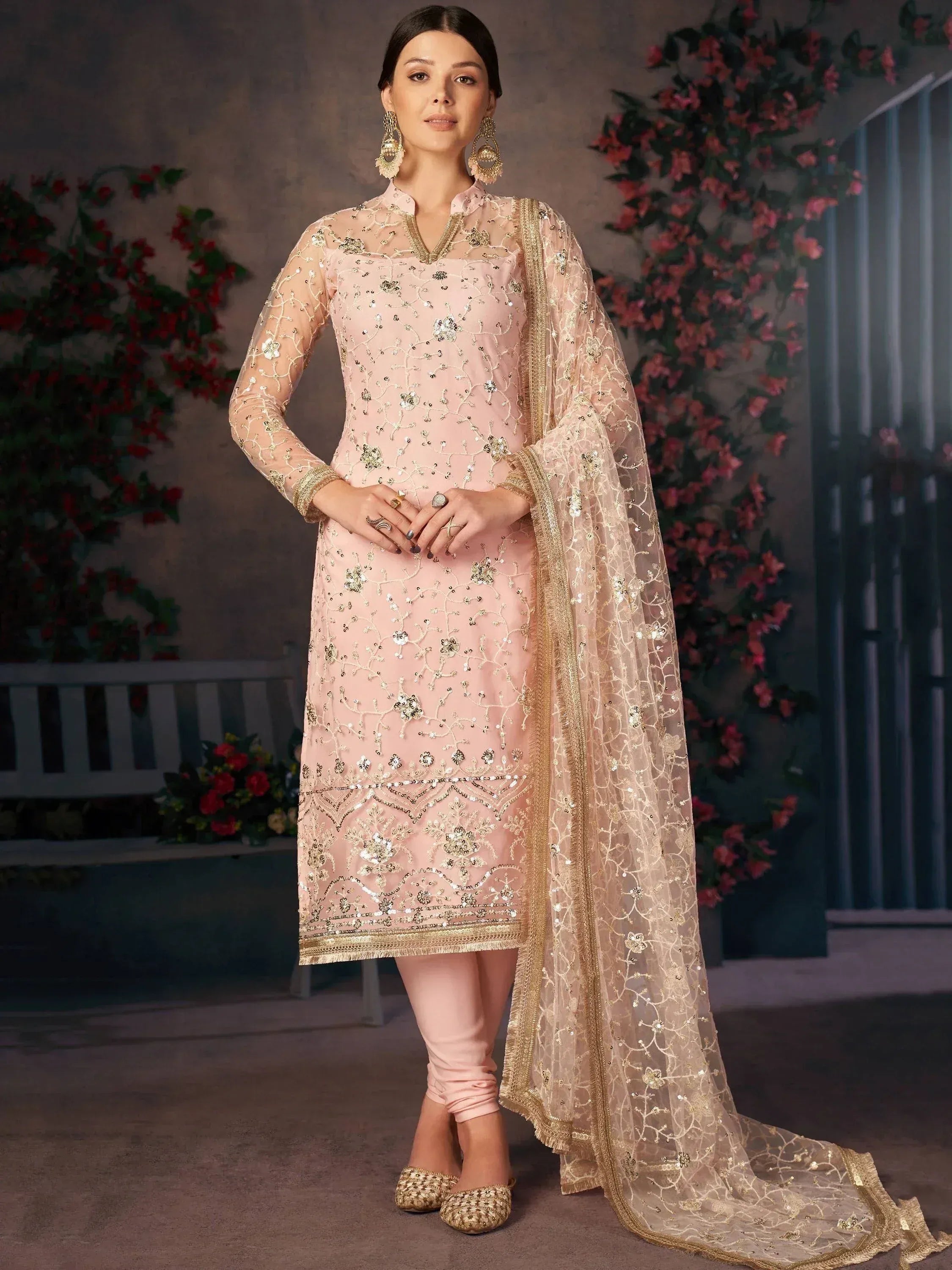 Elegant pink embroidered salwar kameez with gold detailing and matching dupatta, perfect for festive occasions.