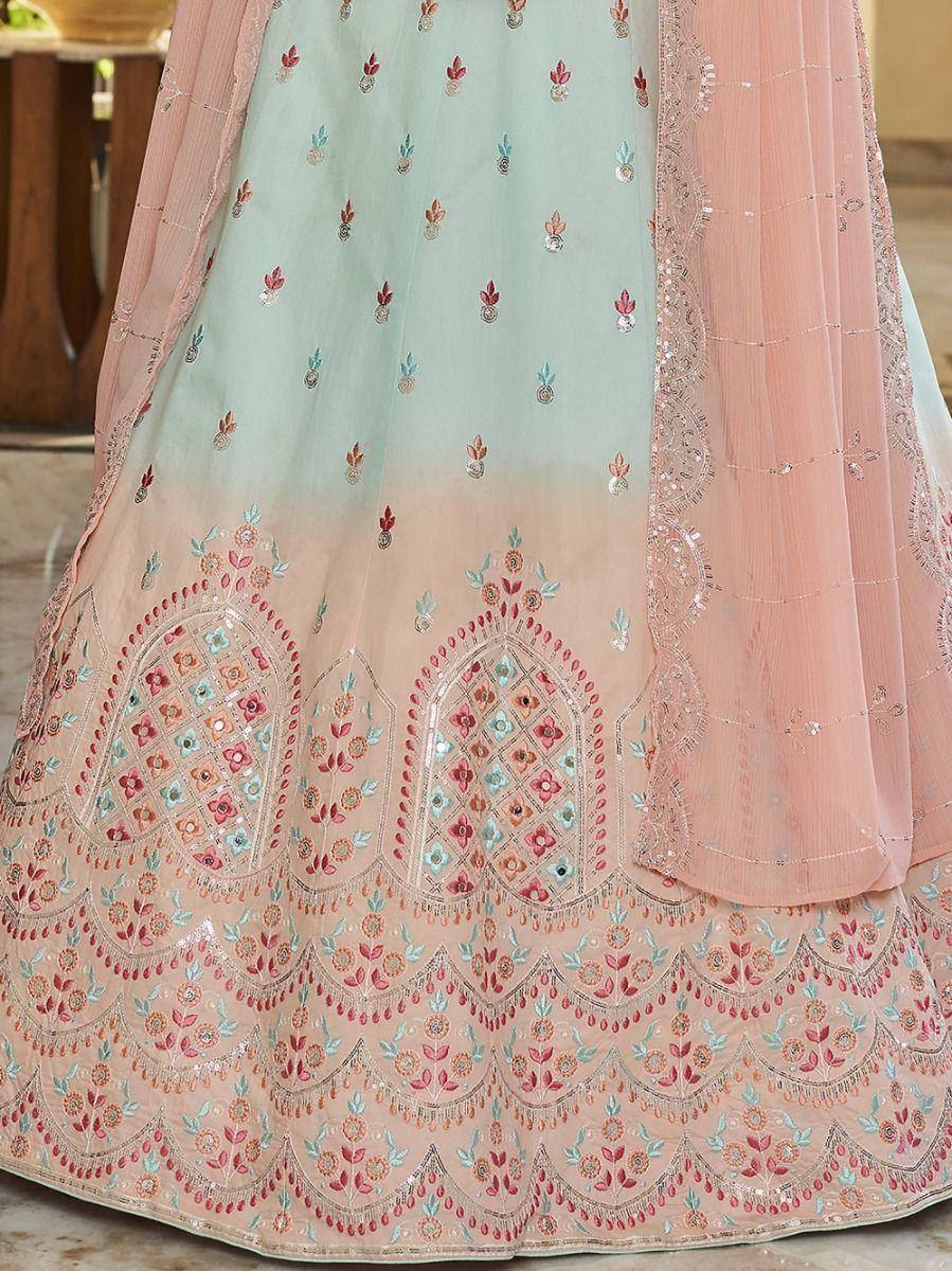 Mint and peach embroidered lehenga choli with floral motifs and sequin detailing, perfect for Indian ethnic wear.
