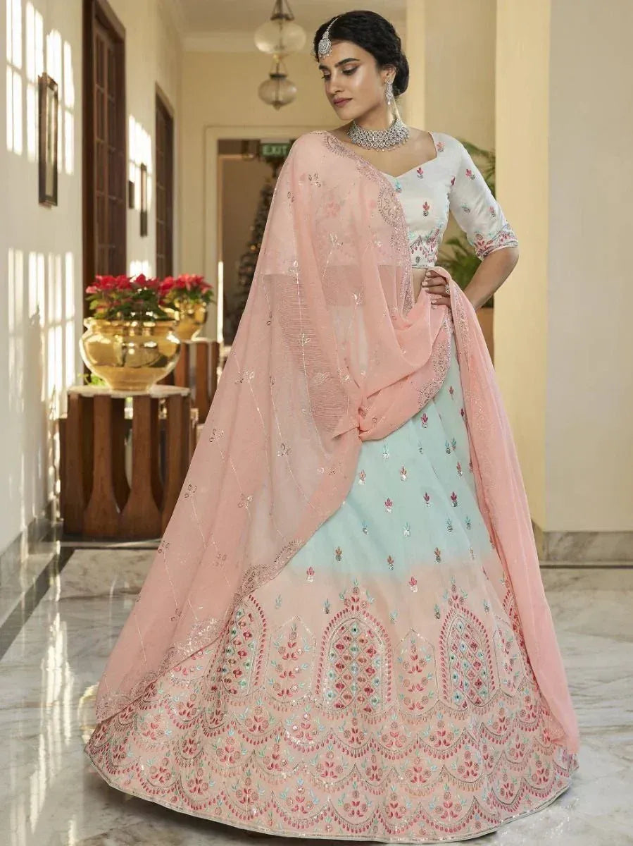 Elegant pastel lehenga choli with intricate embroidery and matching dupatta, perfect for Indian ethnic occasions