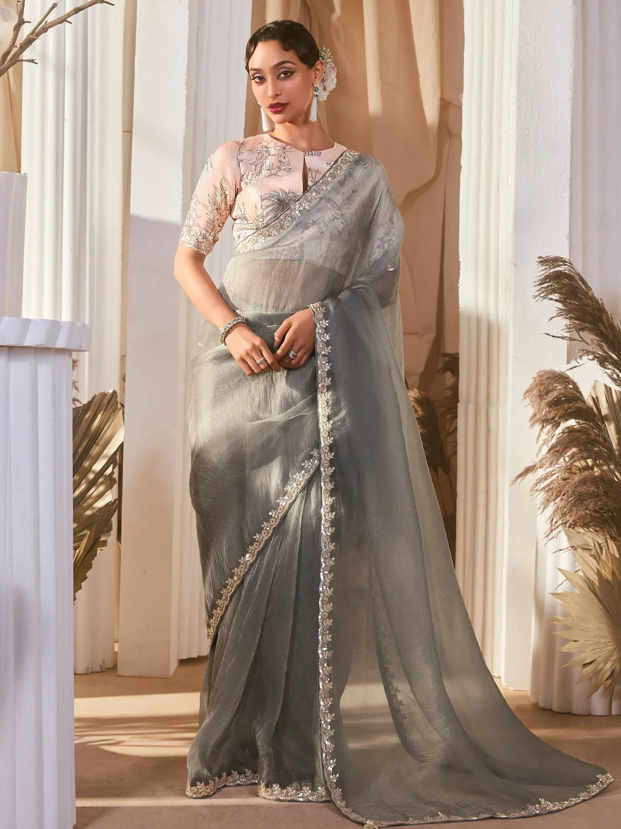Elegant grey saree with floral embroidery and sequin border, paired with a blush blouse for Indian ethnic wear