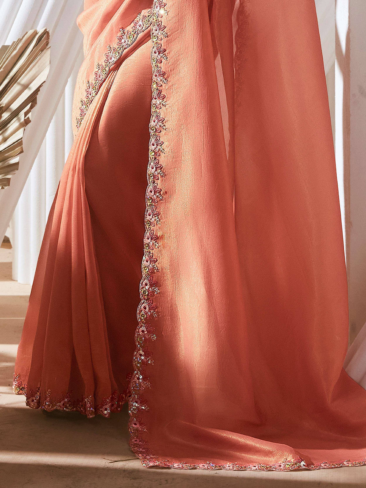 Peach ethnic gown with floral sequin embroidery and high slit, perfect for Indian weddings or parties