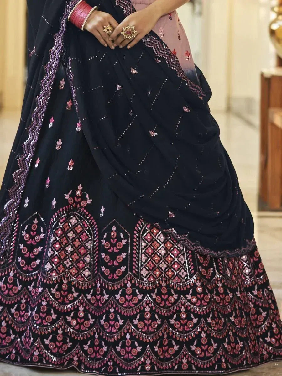 Black lehenga with pink floral embroidery and sequin detailing, perfect for Indian ethnic wear
