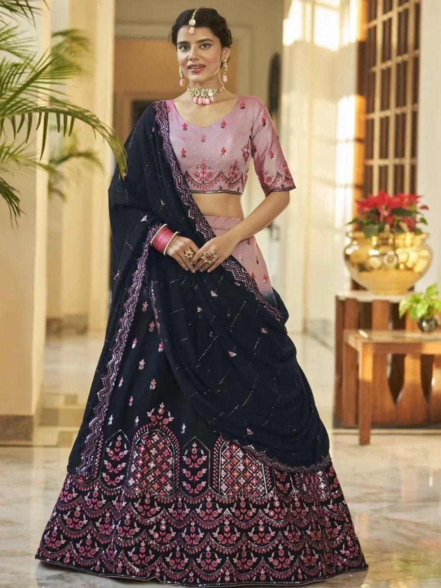 Elegant navy blue lehenga choli with pink embroidery, perfect for Indian weddings and festive occasions.