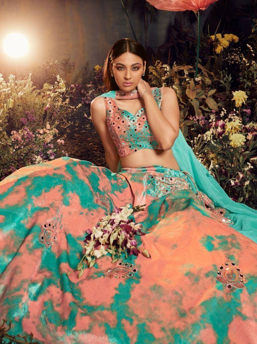 Designer lehenga choli with peacock embroidery, floral backdrop, perfect for Indian ethnic wear events