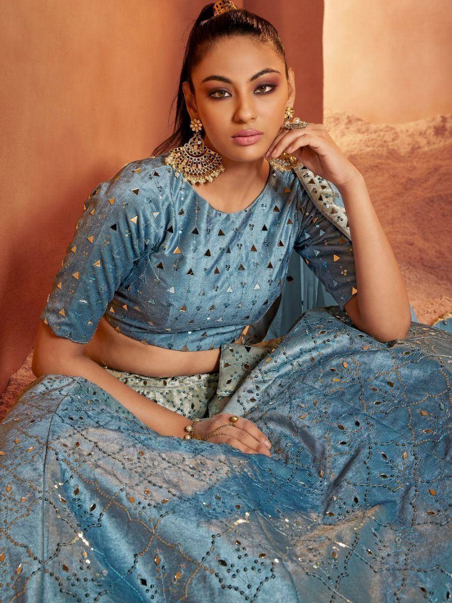 Blue designer lehenga choli with gold triangle embroidery and mirror work, perfect for Indian ethnic wear