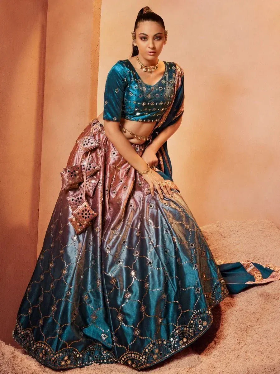 Teal and rose gold embroidered lehenga choli with mirror work, perfect for Indian ethnic wear occasions