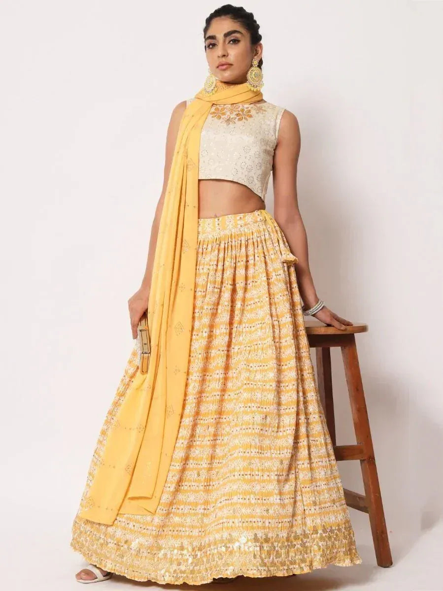 Yellow printed lehenga choli with embroidered crop top and dupatta, Indian ethnic wear for women