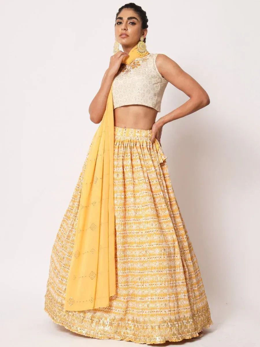 Yellow printed lehenga choli with embroidered crop top and dupatta, Indian ethnic wear for women