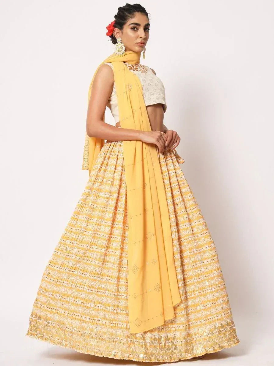 Yellow printed lehenga choli with matching dupatta, ethnic Indian wear for women