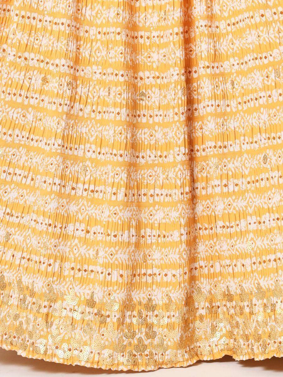 Yellow ethnic gown with white block print and gold sequin hem, pleated design