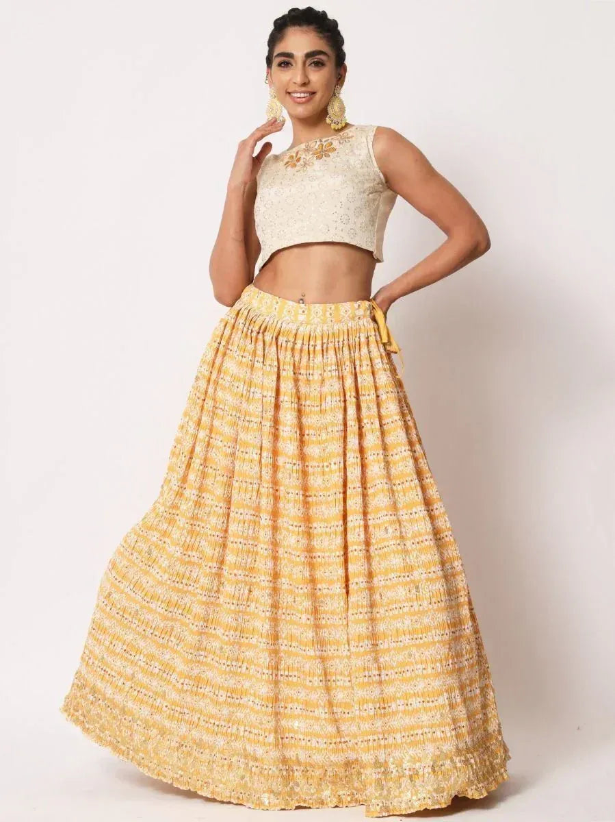 Yellow printed lehenga with embroidered cream crop top, ethnic wear for women