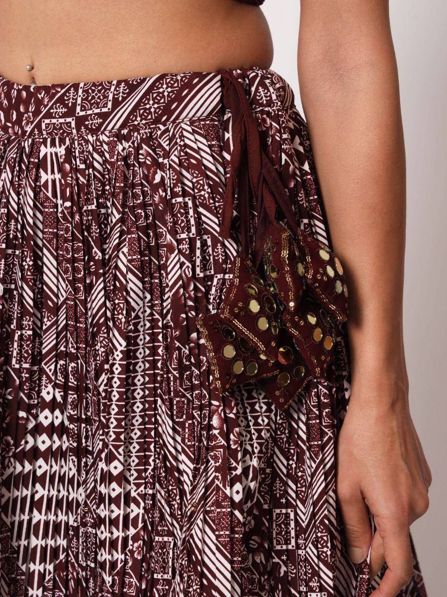 Maroon ethnic skirt with white geometric print and gold mirror embellishments, pleated design