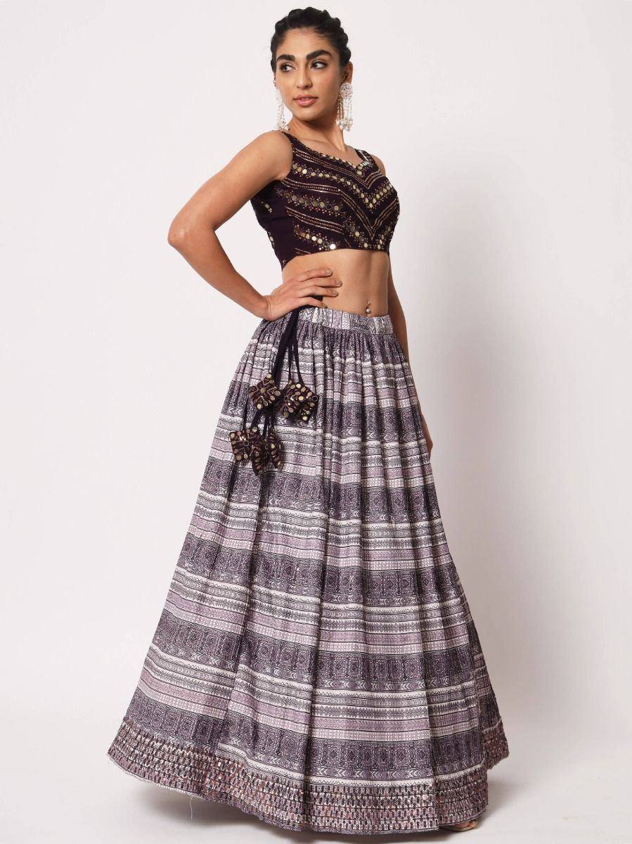 Purple printed lehenga choli with embroidered crop top and flared skirt, ethnic Indian wear