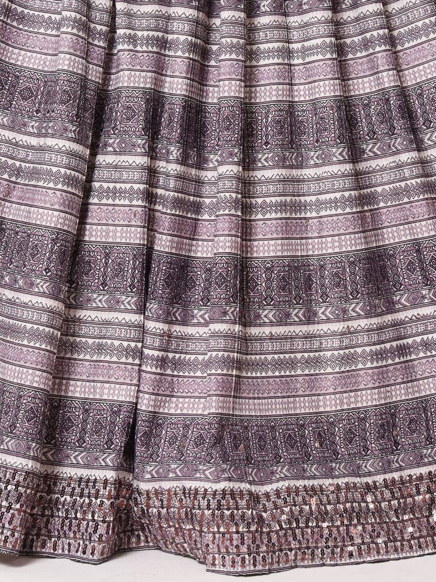Purple and white ethnic printed skirt with geometric patterns and sequin trim, ideal for Indian wear.