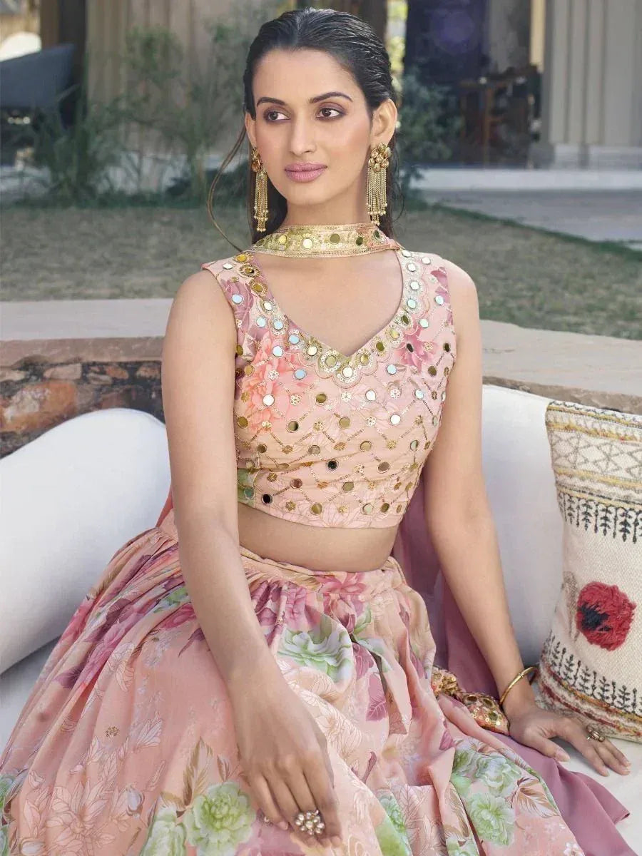 Pink floral lehenga choli with mirror work, gold jewelry, and choker for Indian ethnic wear