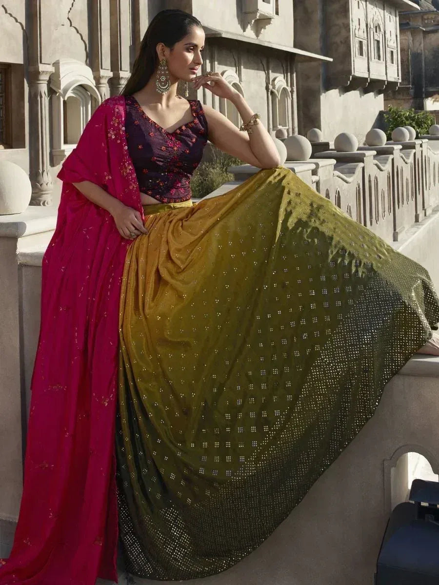 Woman in designer lehenga choli with ombre skirt and pink dupatta, ethnic Indian wear