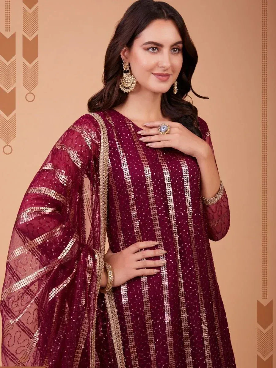Maroon sequin ethnic gown with gold stripes, perfect for Indian festive occasions and weddings