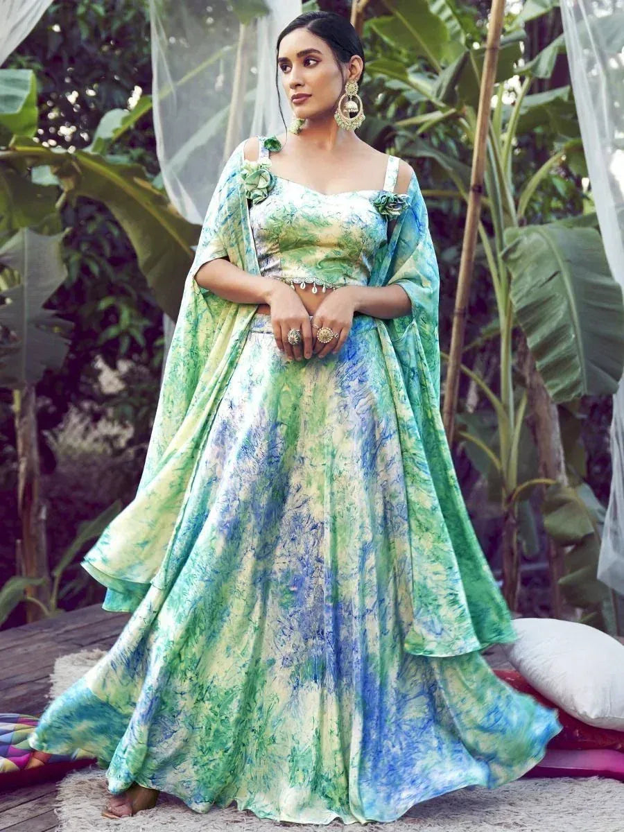 Green and blue tie-dye lehenga choli with floral accents, perfect for ethnic occasions
