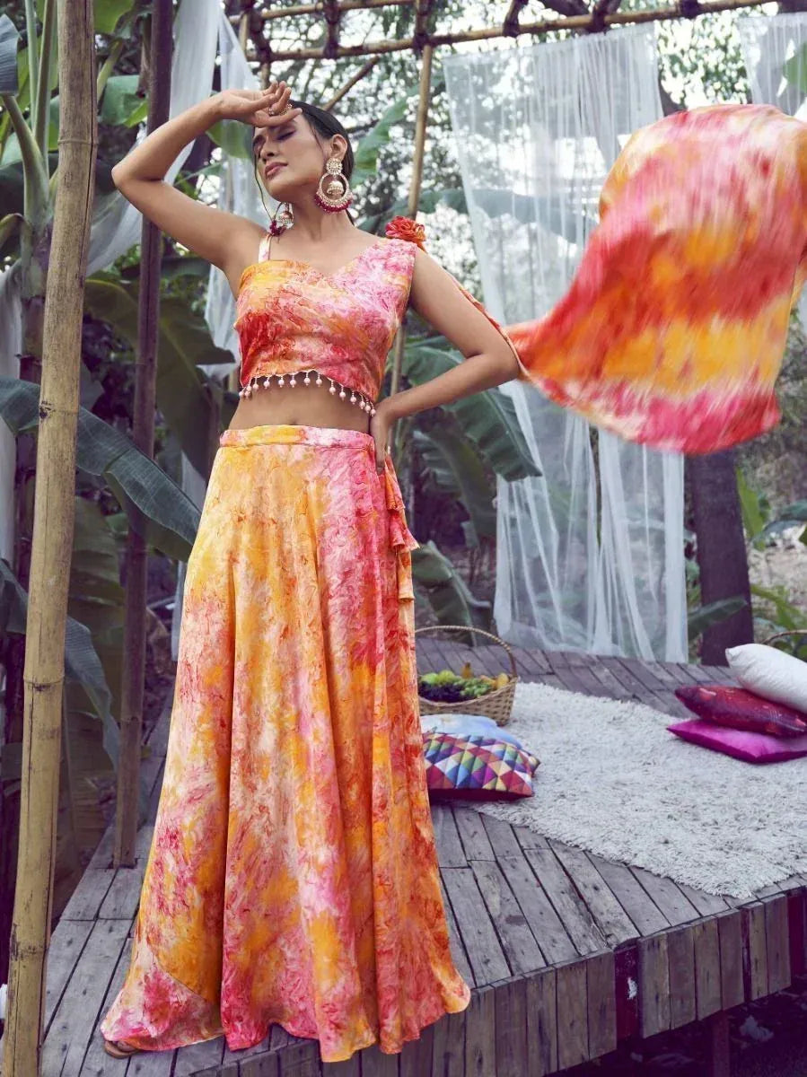 Vibrant tie-dye lehenga choli with floral print, perfect for Indian ethnic wear and festive occasions.