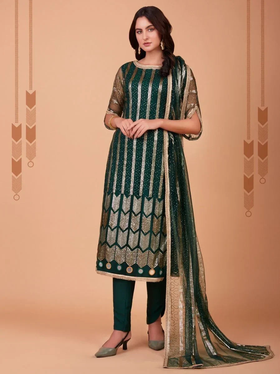 Woman wearing green and gold embroidered salwar kameez with matching dupatta
